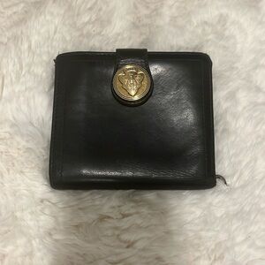 Authentic Vintage Black leather wallet with wear and tear.